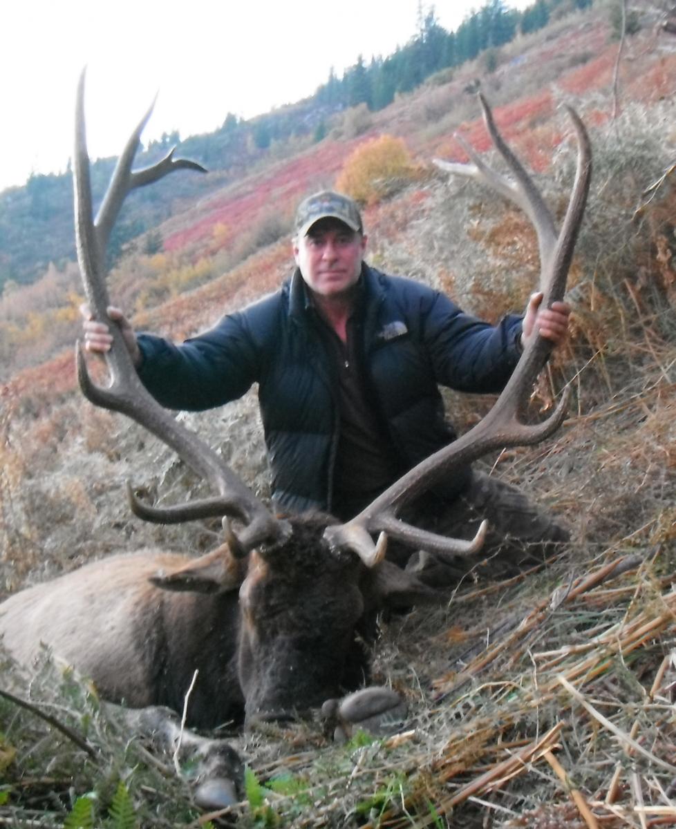 Hunter posing with trophy elk