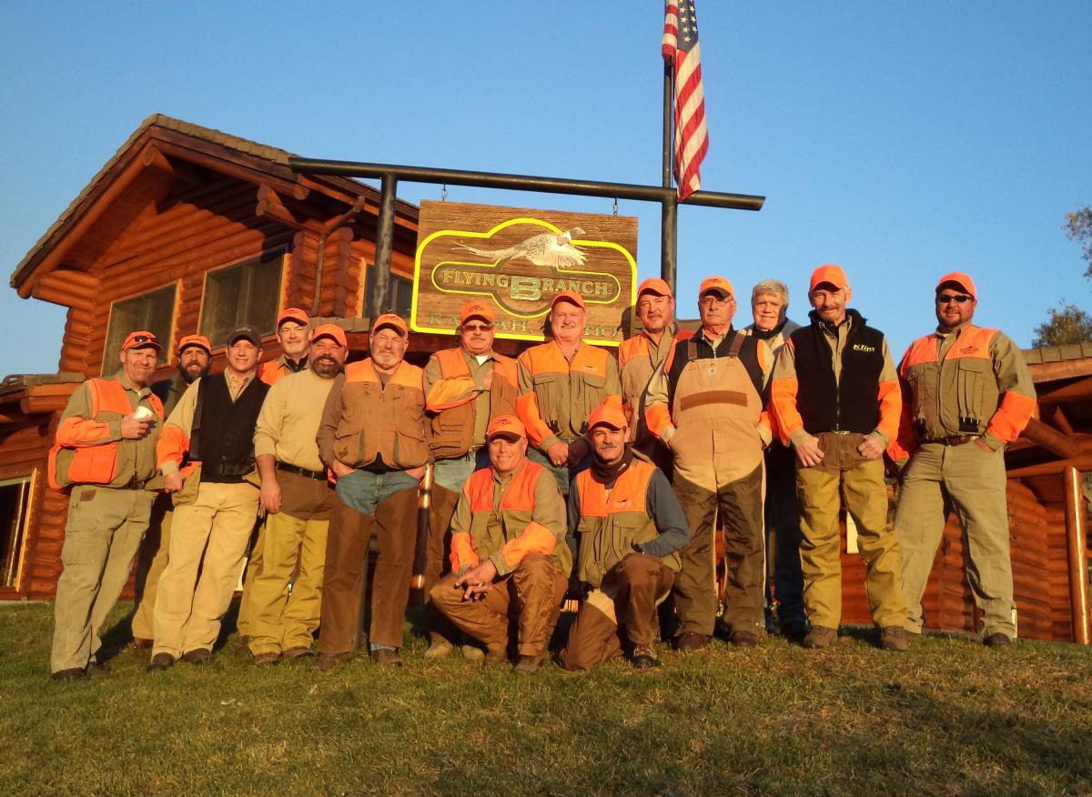 corporate group in front of lodge