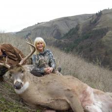 couple with ranch whitetail