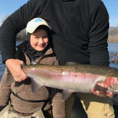 young man with his first steelhead