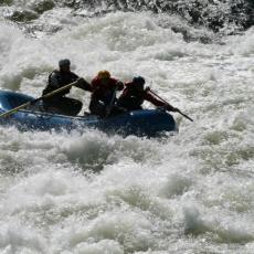 Group of whitewater rafters on river