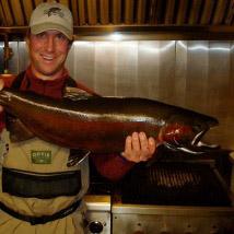 Ryan with fish in the kitchen, Ryan Nelson